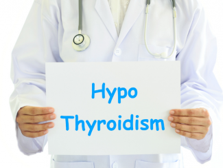 Partial image of a doctor with a stethoscope holding a white sheet with the text HypoThyroidism