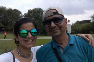 Mariyam with her father in a nice outside setting