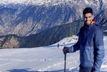 A man with lupus nephritis on a snow capped mountain 