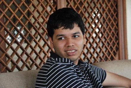 Image: Roshan Orko Roy sitting on a sofa 