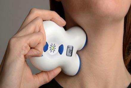 Image of Vagus Nerve Stimulator Gammacore on the neck of a person to help with Migraine Pain