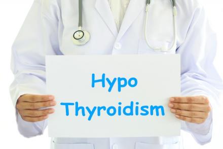 A partial image of a doctor with a stethoscope holding a white sheet with the text HypoThyroidismHy